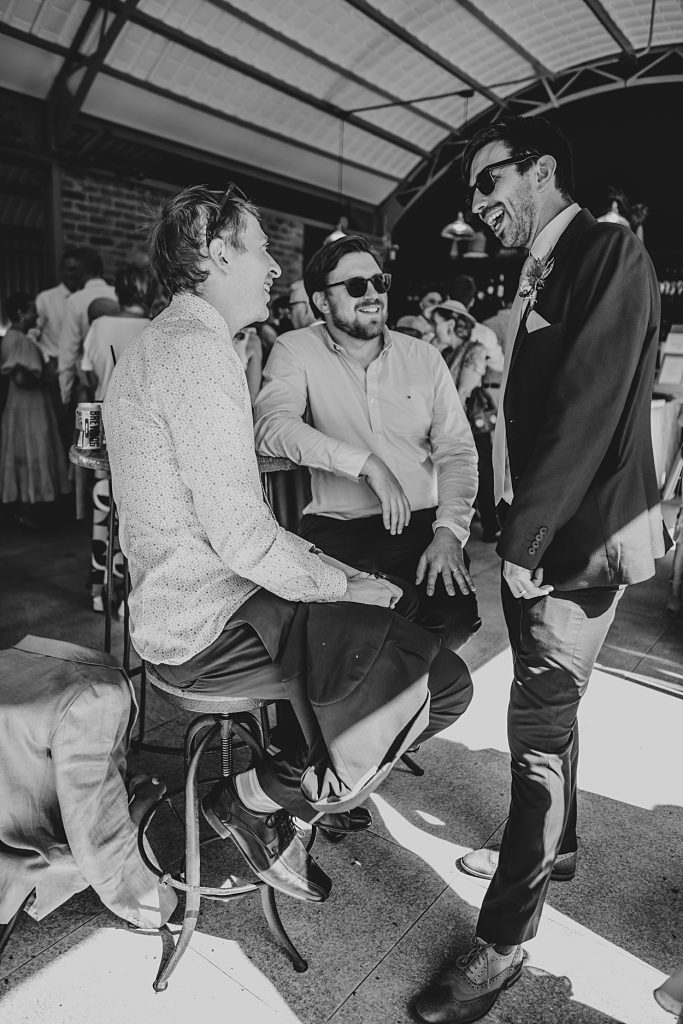 Multi coloured Summer wedding with a bride wearing green at The Barns at Lodge Farm. Essex documentary wedding photographer