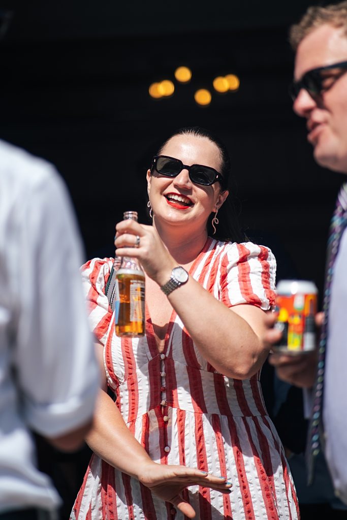 Multi coloured Summer wedding with a bride wearing green at The Barns at Lodge Farm. Essex documentary wedding photographer