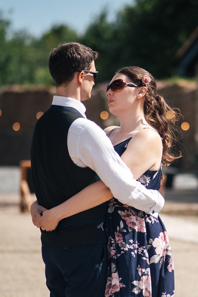Multi coloured Summer wedding with a bride wearing green at The Barns at Lodge Farm. Essex documentary wedding photographer