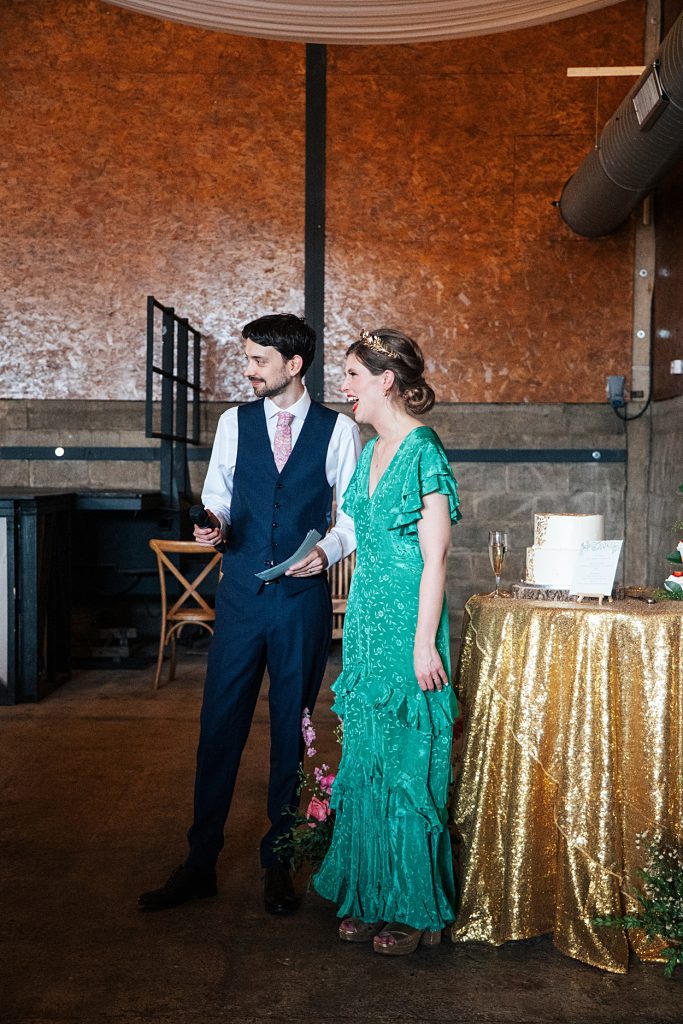 Multi coloured Summer wedding with a bride wearing green at The Barns at Lodge Farm. Essex documentary wedding photographer
