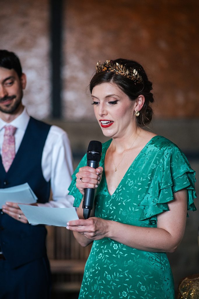 Multi coloured Summer wedding with a bride wearing green at The Barns at Lodge Farm. Essex documentary wedding photographer