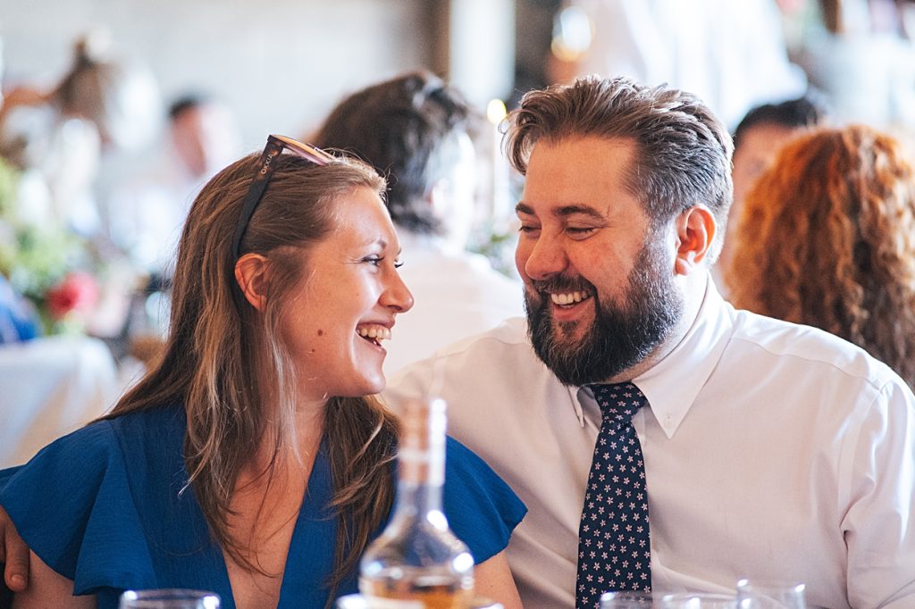 Multi coloured Summer wedding with a bride wearing green at The Barns at Lodge Farm. Essex documentary wedding photographer