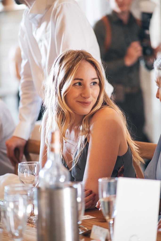 Multi coloured Summer wedding with a bride wearing green at The Barns at Lodge Farm. Essex documentary wedding photographer