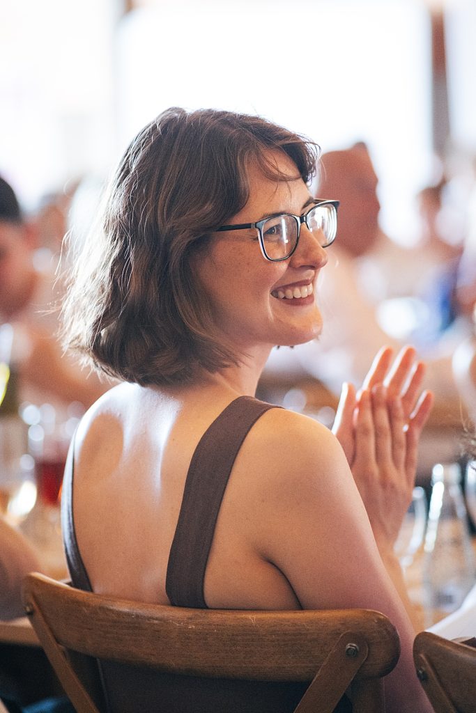 Multi coloured Summer wedding with a bride wearing green at The Barns at Lodge Farm. Essex documentary wedding photographer