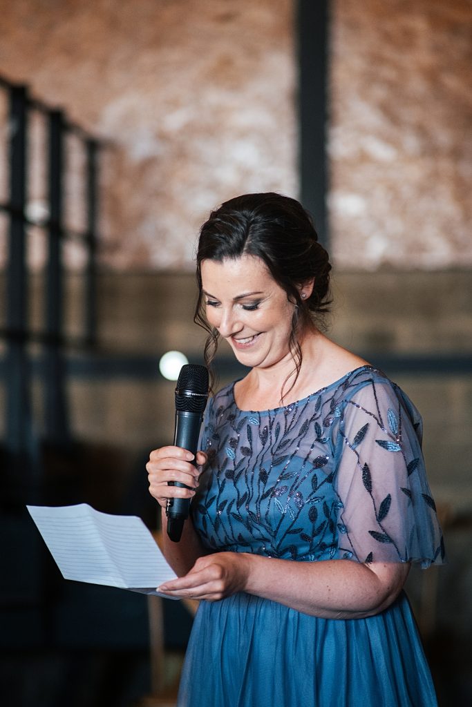 Multi coloured Summer wedding with a bride wearing green at The Barns at Lodge Farm. Essex documentary wedding photographer
