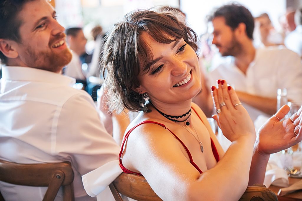 Multi coloured Summer wedding with a bride wearing green at The Barns at Lodge Farm. Essex documentary wedding photographer