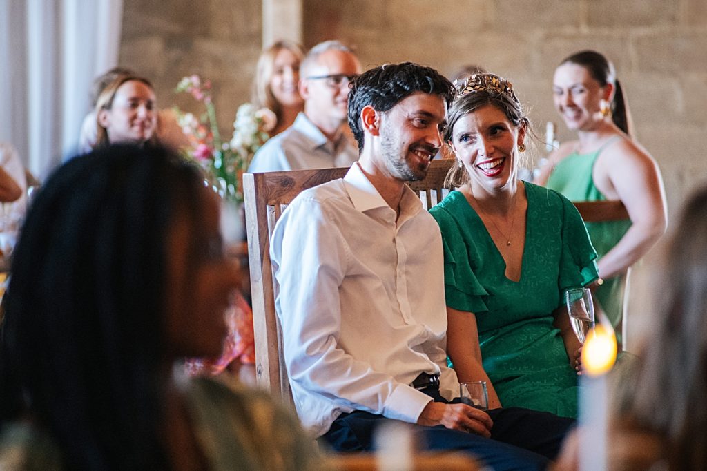 Multi coloured Summer wedding with a bride wearing green at The Barns at Lodge Farm. Essex documentary wedding photographer