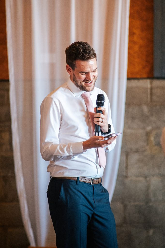 Multi coloured Summer wedding with a bride wearing green at The Barns at Lodge Farm. Essex documentary wedding photographer
