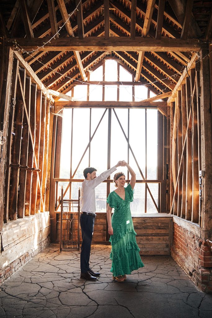 Multi coloured Summer wedding with a bride wearing green at The Barns at Lodge Farm. Essex documentary wedding photographer