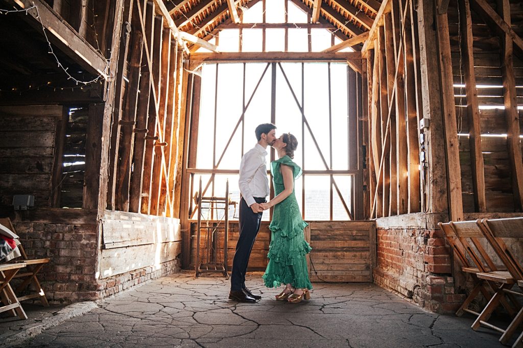 Multi coloured Summer wedding with a bride wearing green at The Barns at Lodge Farm. Essex documentary wedding photographer