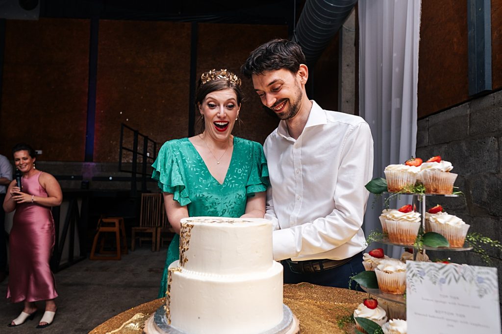 Multi coloured Summer wedding with a bride wearing green at The Barns at Lodge Farm. Essex documentary wedding photographer