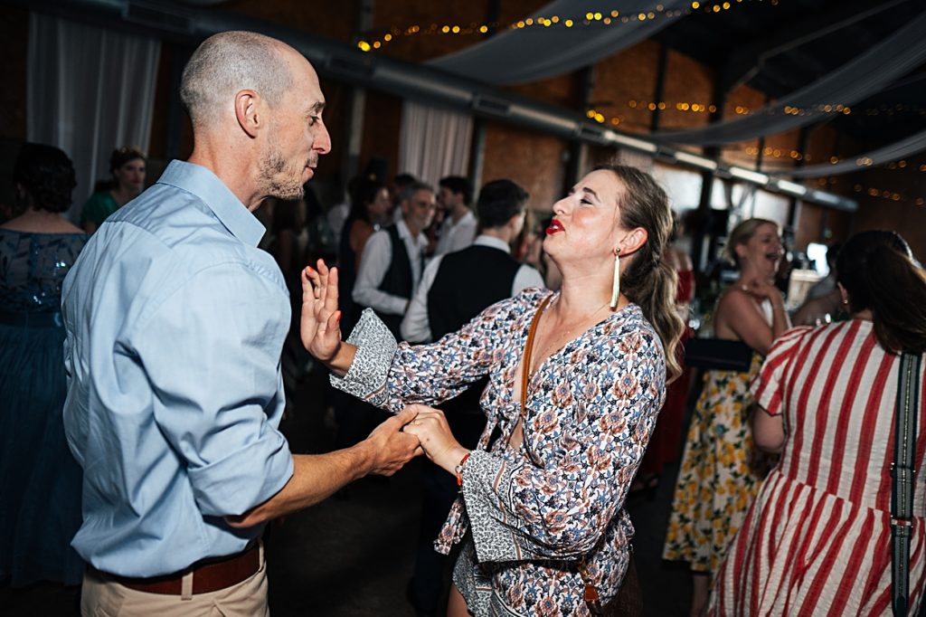 Multi coloured Summer wedding with a bride wearing green at The Barns at Lodge Farm. Essex documentary wedding photographer