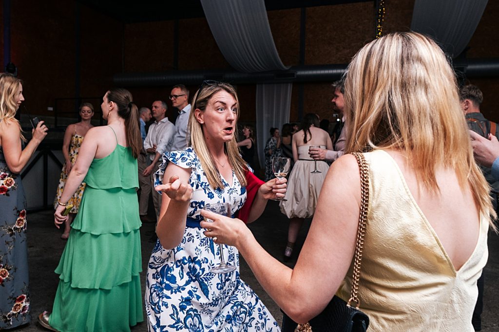 Multi coloured Summer wedding with a bride wearing green at The Barns at Lodge Farm. Essex documentary wedding photographer