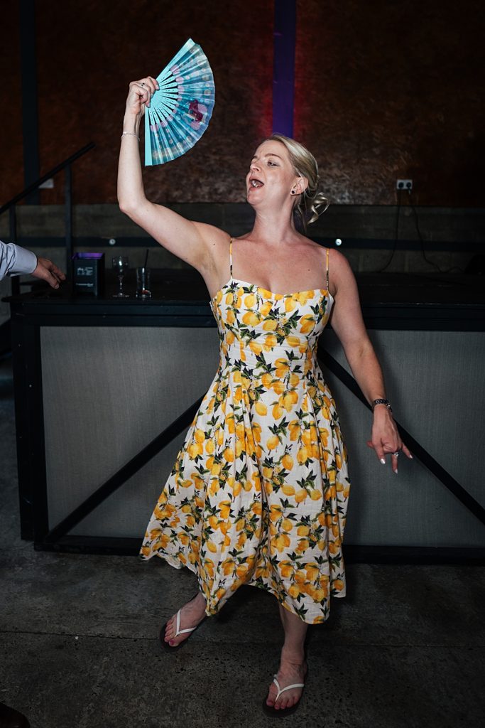 Multi coloured Summer wedding with a bride wearing green at The Barns at Lodge Farm. Essex documentary wedding photographer