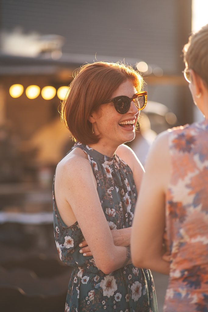 Multi coloured Summer wedding with a bride wearing green at The Barns at Lodge Farm. Essex documentary wedding photographer