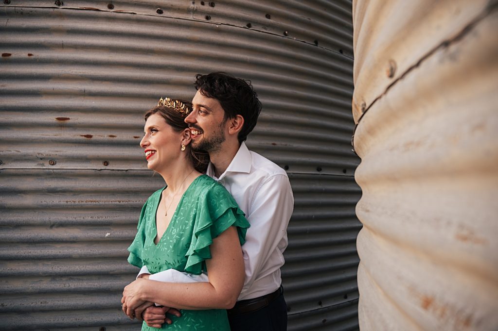 Multi coloured Summer wedding with a bride wearing green at The Barns at Lodge Farm. Essex documentary wedding photographer