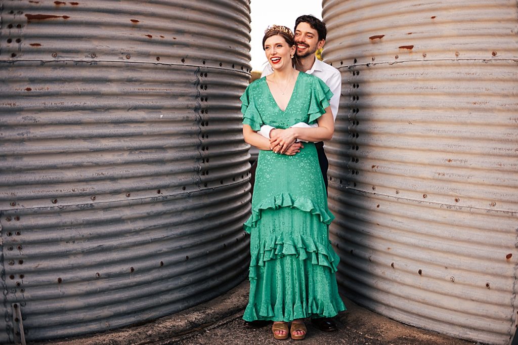 Multi coloured Summer wedding with a bride wearing green at The Barns at Lodge Farm. Essex documentary wedding photographer