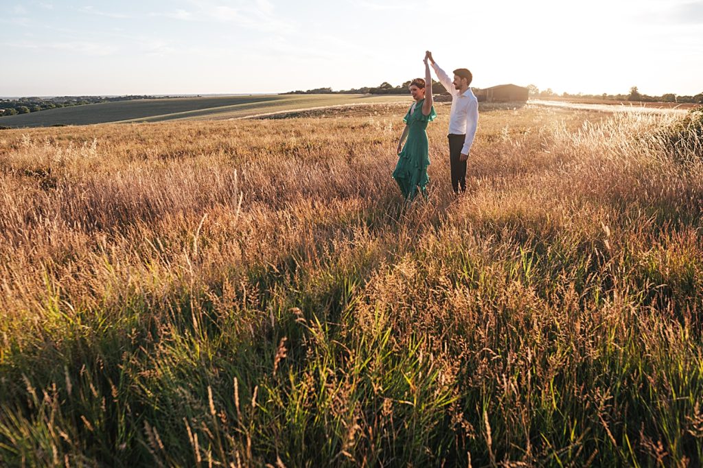 Multi coloured Summer wedding with a bride wearing green at The Barns at Lodge Farm. Essex documentary wedding photographer