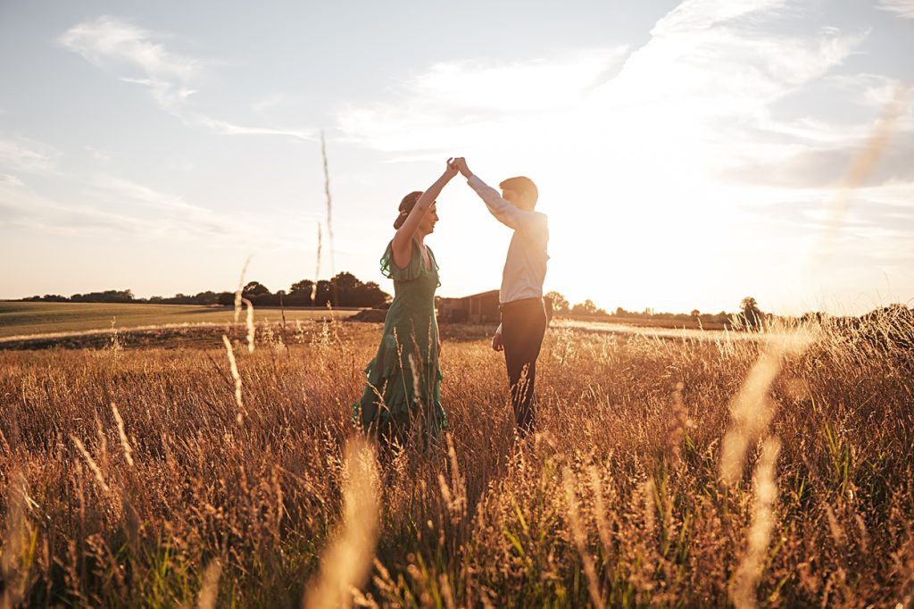 Multi coloured Summer wedding with a bride wearing green at The Barns at Lodge Farm. Essex documentary wedding photographer 