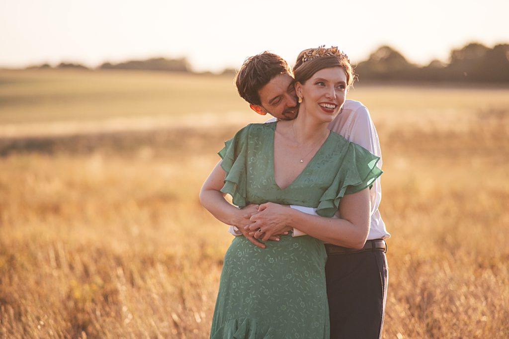 Multi coloured Summer wedding with a bride wearing green at The Barns at Lodge Farm. Essex documentary wedding photographer