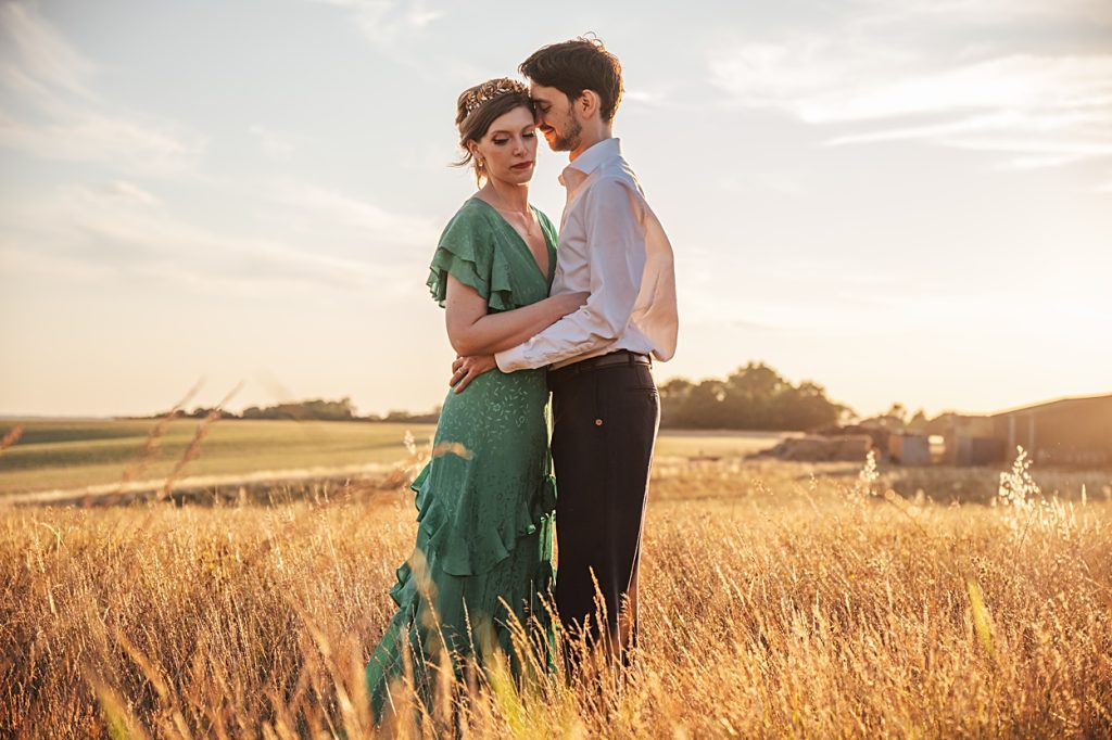 Multi coloured Summer wedding with a bride wearing green at The Barns at Lodge Farm. Essex documentary wedding photographer