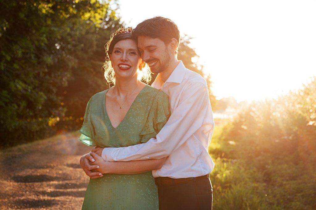 Multi coloured Summer wedding with a bride wearing green at The Barns at Lodge Farm. Essex documentary wedding photographer