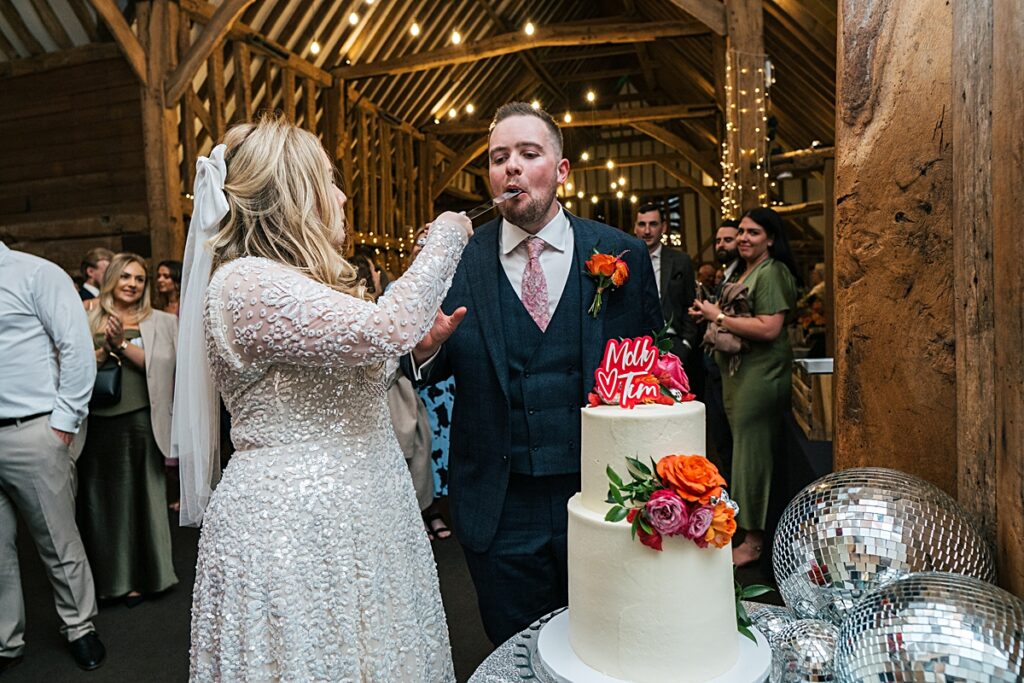 hot pink, orange and disco balls for autumn wedding at Blake Hall