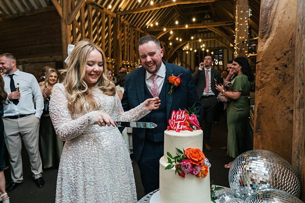 hot pink, orange and disco balls for autumn wedding at Blake Hall
