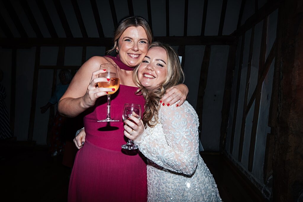 hot pink, orange and disco balls for autumn wedding at Blake Hall