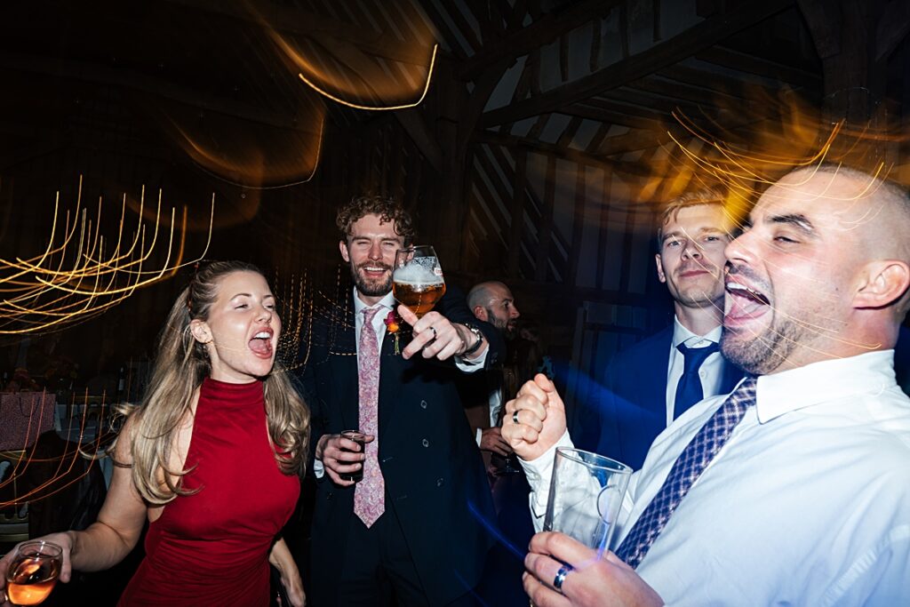 hot pink, orange and disco balls for autumn wedding at Blake Hall