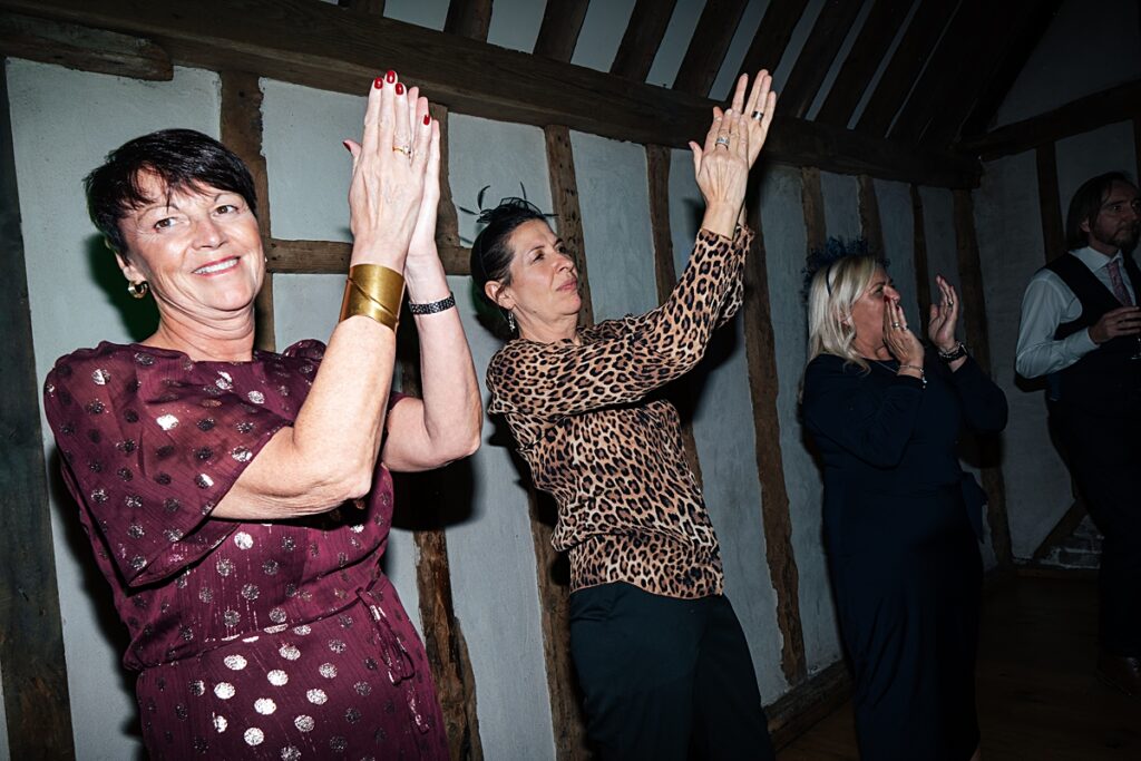 hot pink, orange and disco balls for autumn wedding at Blake Hall